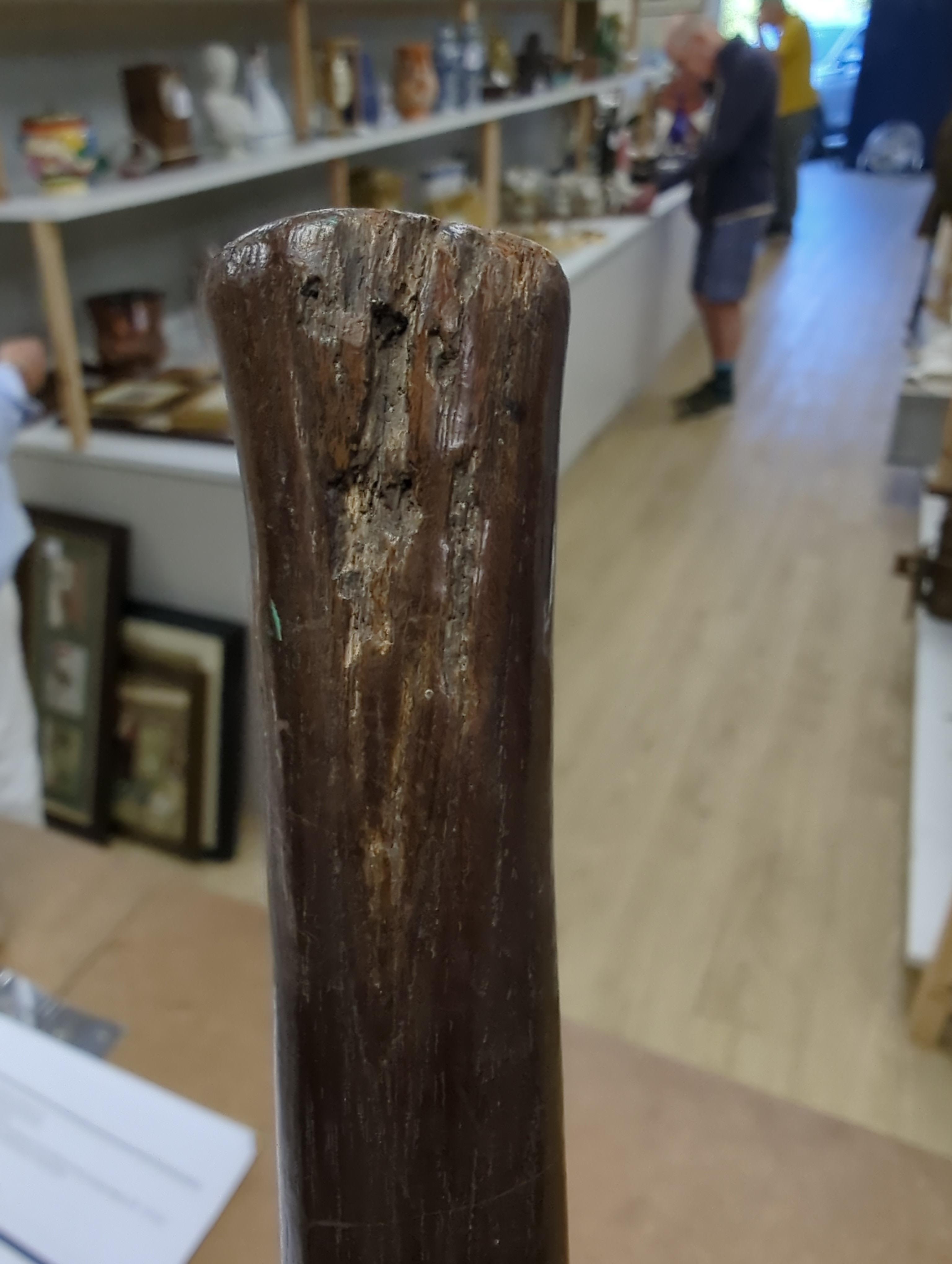 A tribal mask, a Knobkerrie and stick with carved head, stick 62.5cm